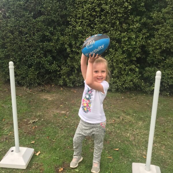 Little-girl-using-AFL-ball-crop