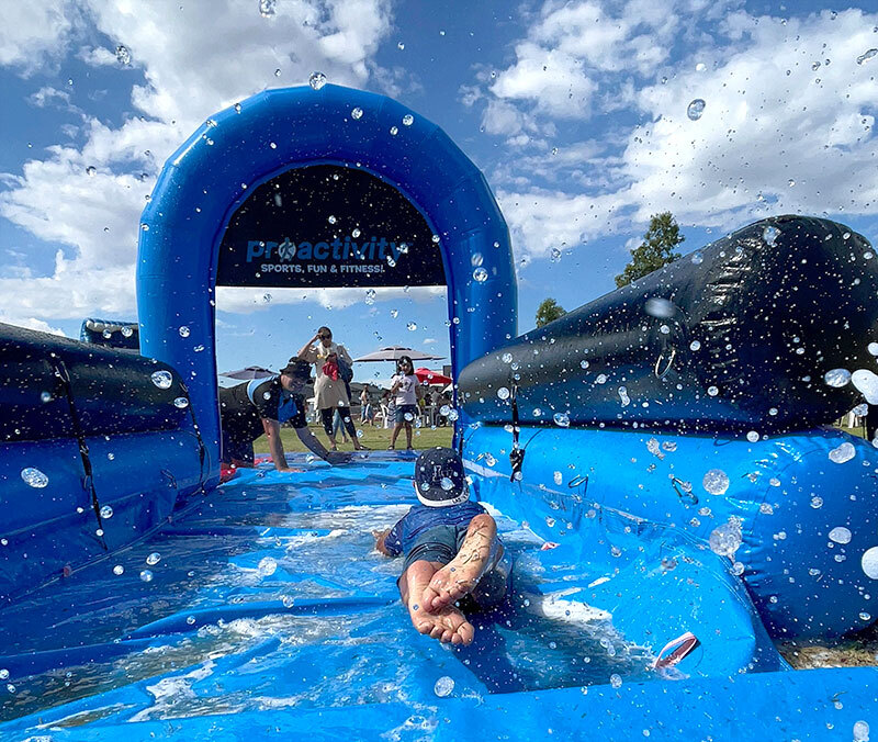 kid-inflatable-water-slide-outdoor-community-event-proactivity