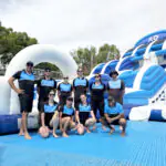 The Proactivity crew with the custom-branded Australian Open inflatable slide